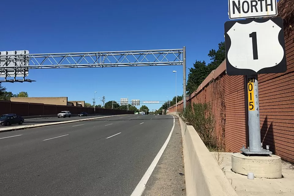 Wide asphalt road with "North Route 1" sign